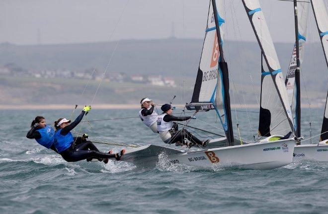 Martine Soffiatti Grael and Kahena Kunze, BRA, Paris Henken and Helena Scutt, USA, Women's Skiff (49erFX) on day four - 2015 ISAF Sailing WC Weymouth and Portland © onEdition http://www.onEdition.com